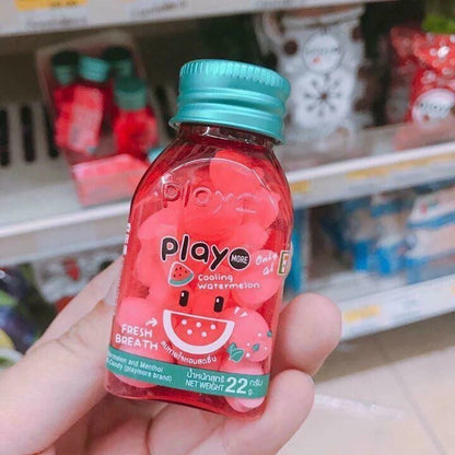 Playmore Watermelon Candy handheld at store shelf for size reference