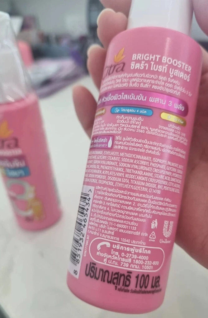 Citra Bright Booster Serum Vitamin C Hya UV Protection in a pink bottle, 100ml, showcasing product details and ingredients.