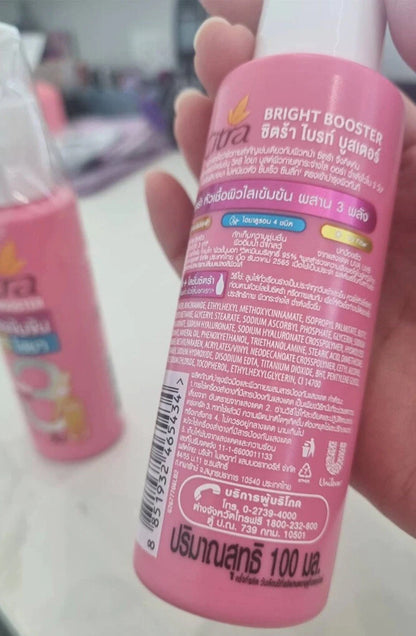 Citra Bright Booster Serum Vitamin C Hya UV Protection in a pink bottle, 100ml, showcasing product details and ingredients.