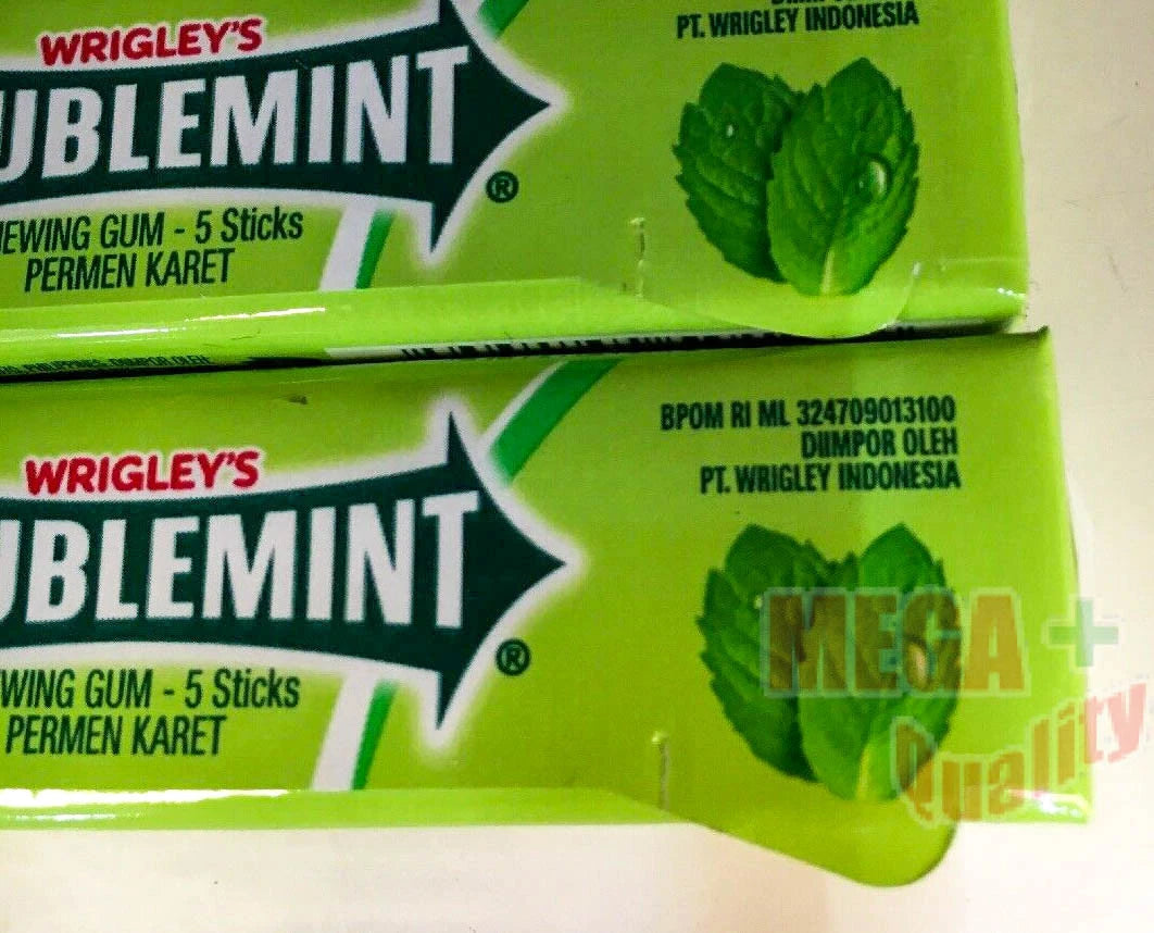 Wrigley Doublemint Chewing Gum sticks showing peppermint mint branding on bright green wrappers.