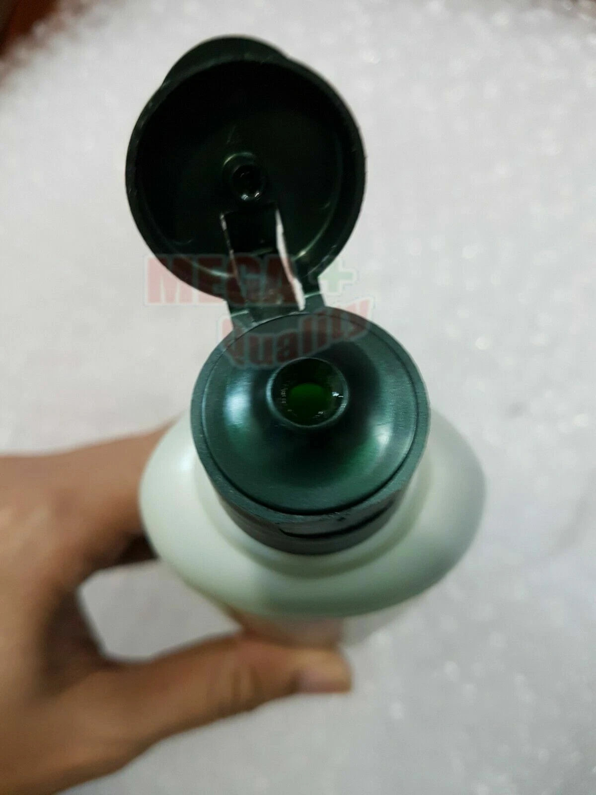 Kokliang Herbal Shampoo open bottle showing liquid inside