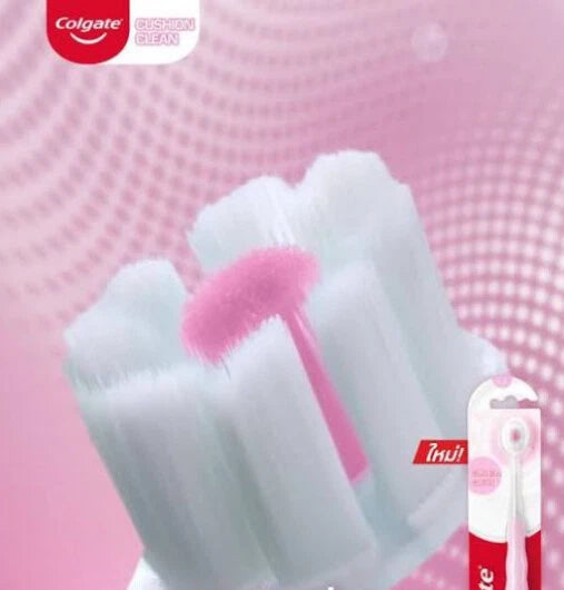Colgate Cushion Clean Toothbrush close-up of super-dense fluffy soft bristles with pink center for gentle gum massage