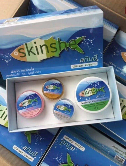 Skinshe Whitening Cream Set displayed inside packaging with multiple jars and foam cleanser