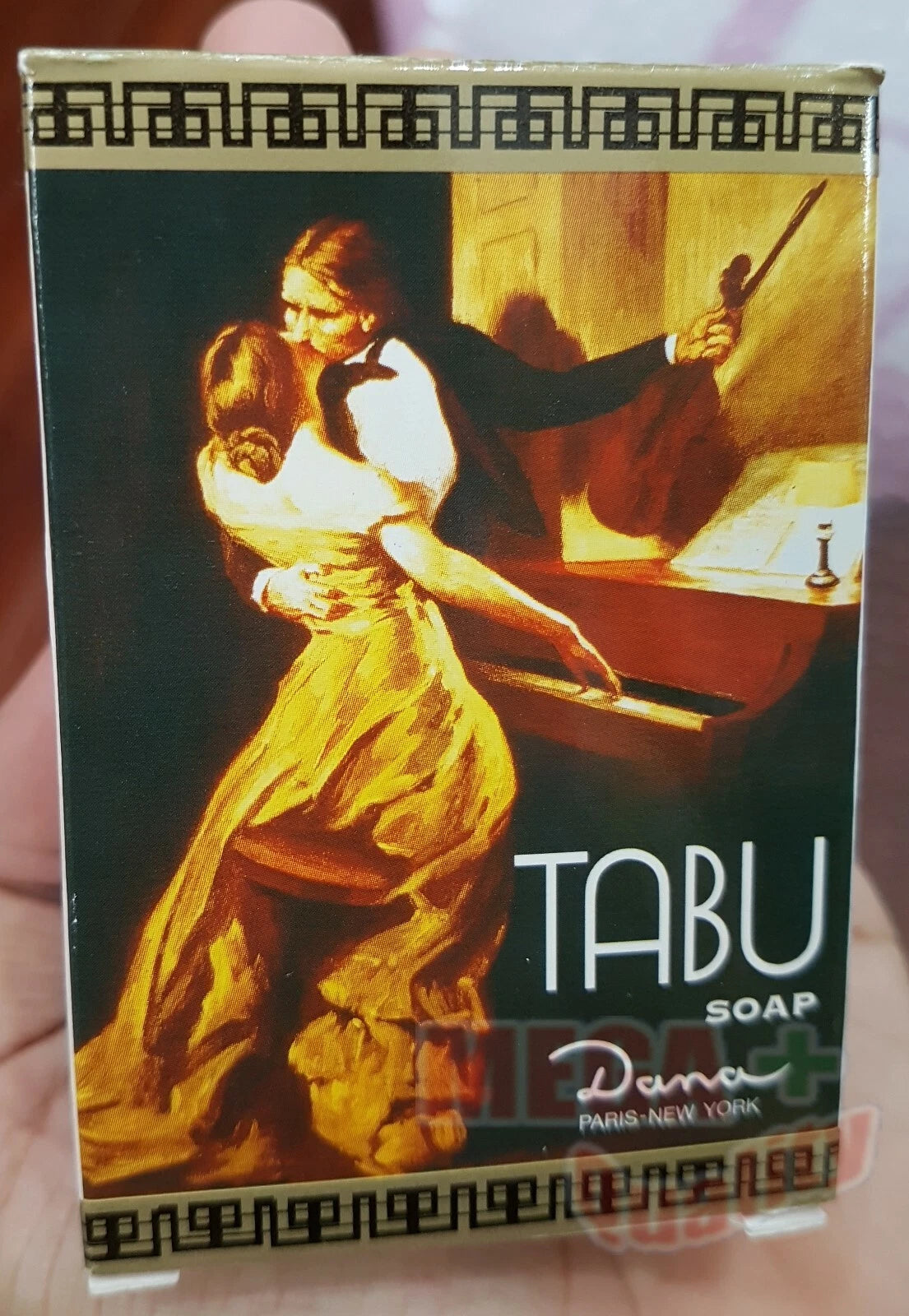 Close up of the classic painting on the front of the Tabu Dana Soap Bar box, featuring the 'TABU' branding.
