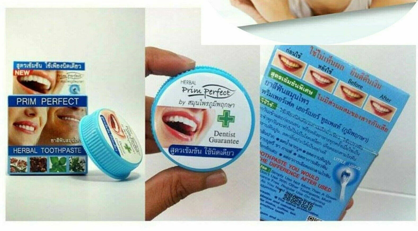 Person holding Prim Perfect Thai Herbal Toothpaste 5g Strong Formula Clove showing product size and label
