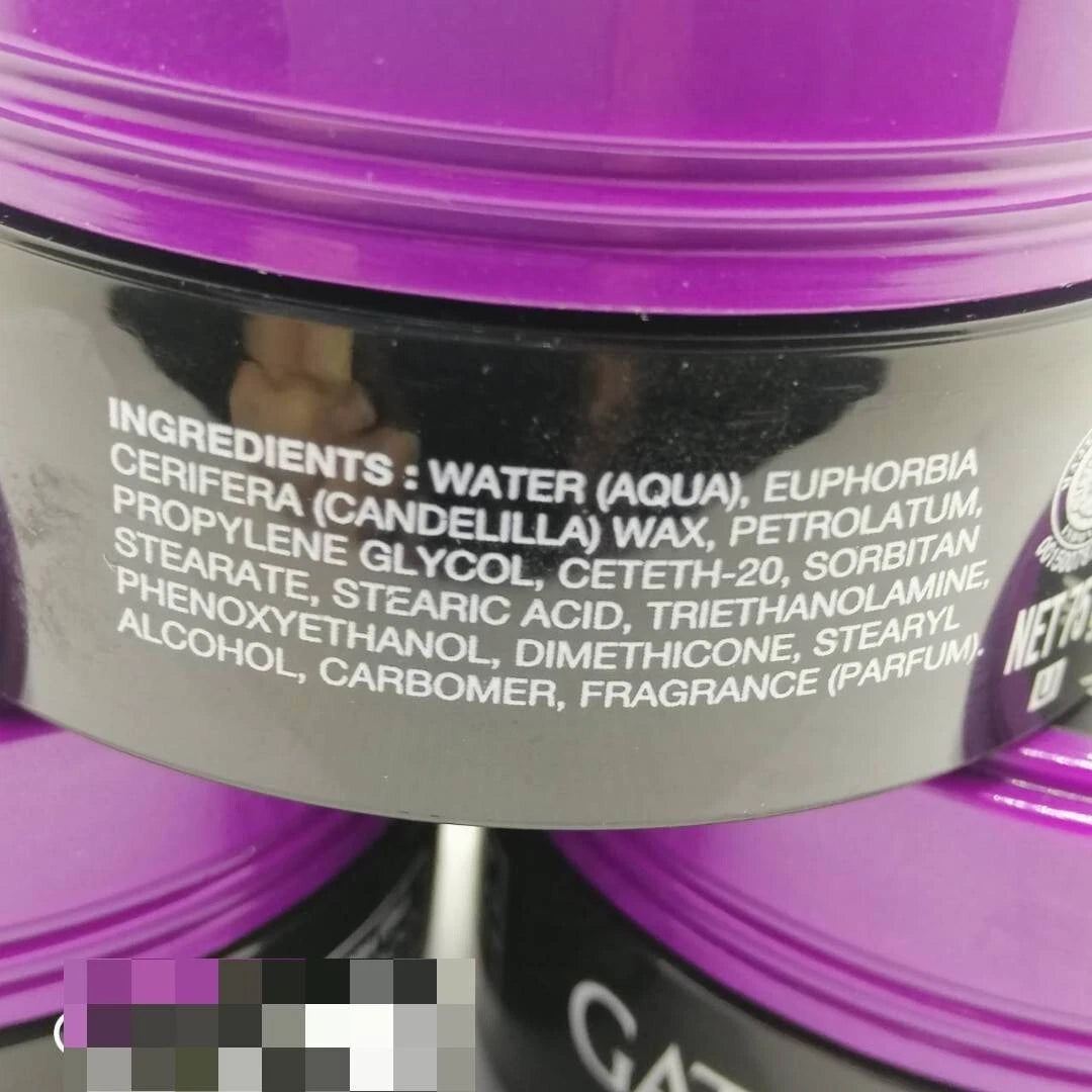 Close-up side view of GATSBY WAX ULTIMATE SHAGGY container showing ingredients label and packaging details