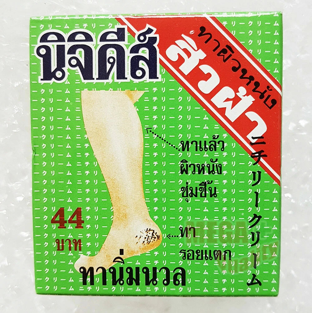 Front of the green and red NICHIDI Cracked Skin Cream box showing Thai text and image of a leg