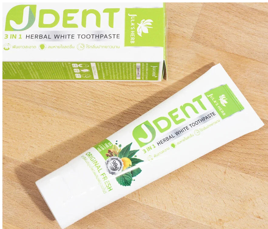 Jula Herb JDent Toothpaste tube placed on wooden surface natural setting