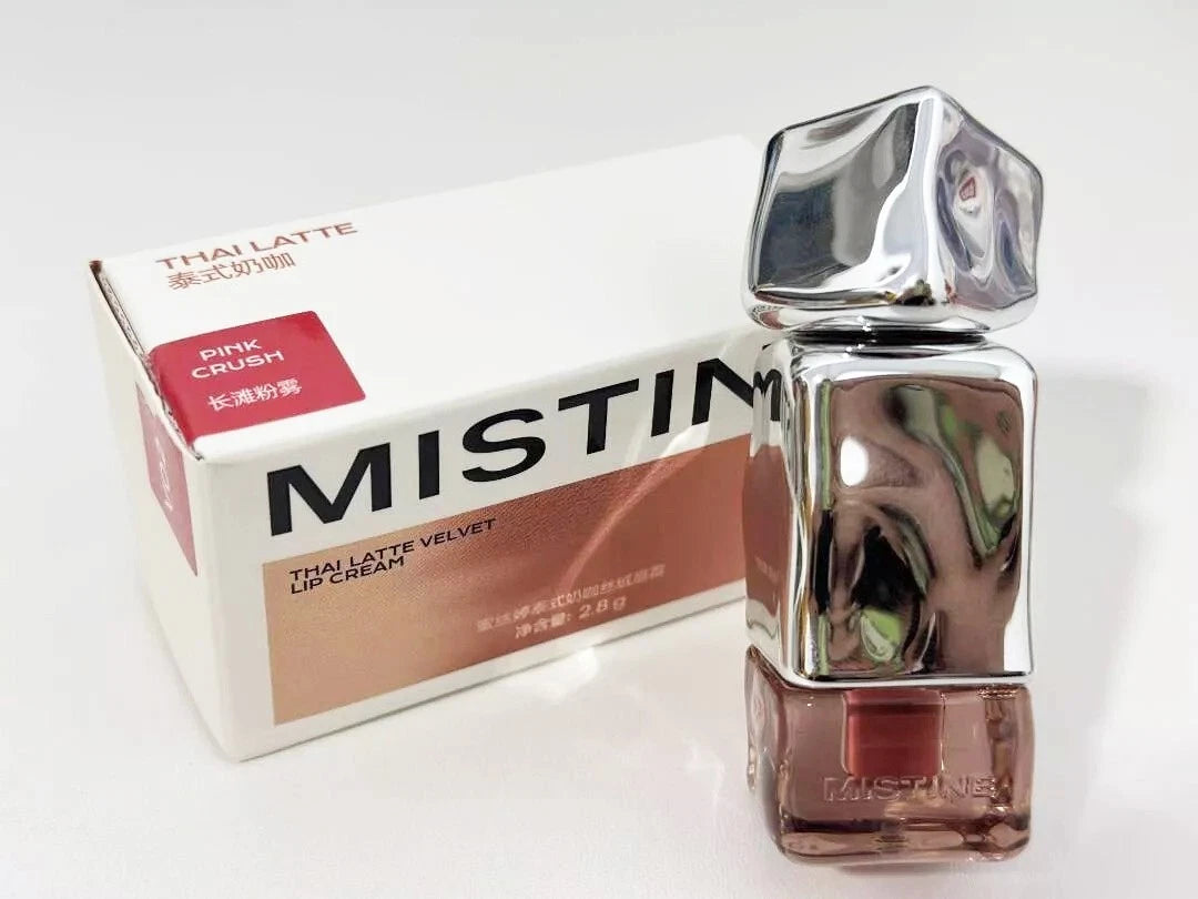 Real product photo of Mistine Velvet Lip Cream tube with its original packaging box on a white background.