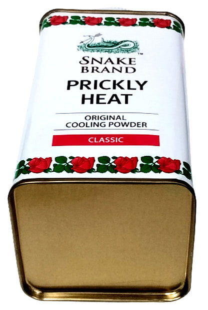 Snake brand prickly heat powder opened can top view showing fine white cooling talc texture