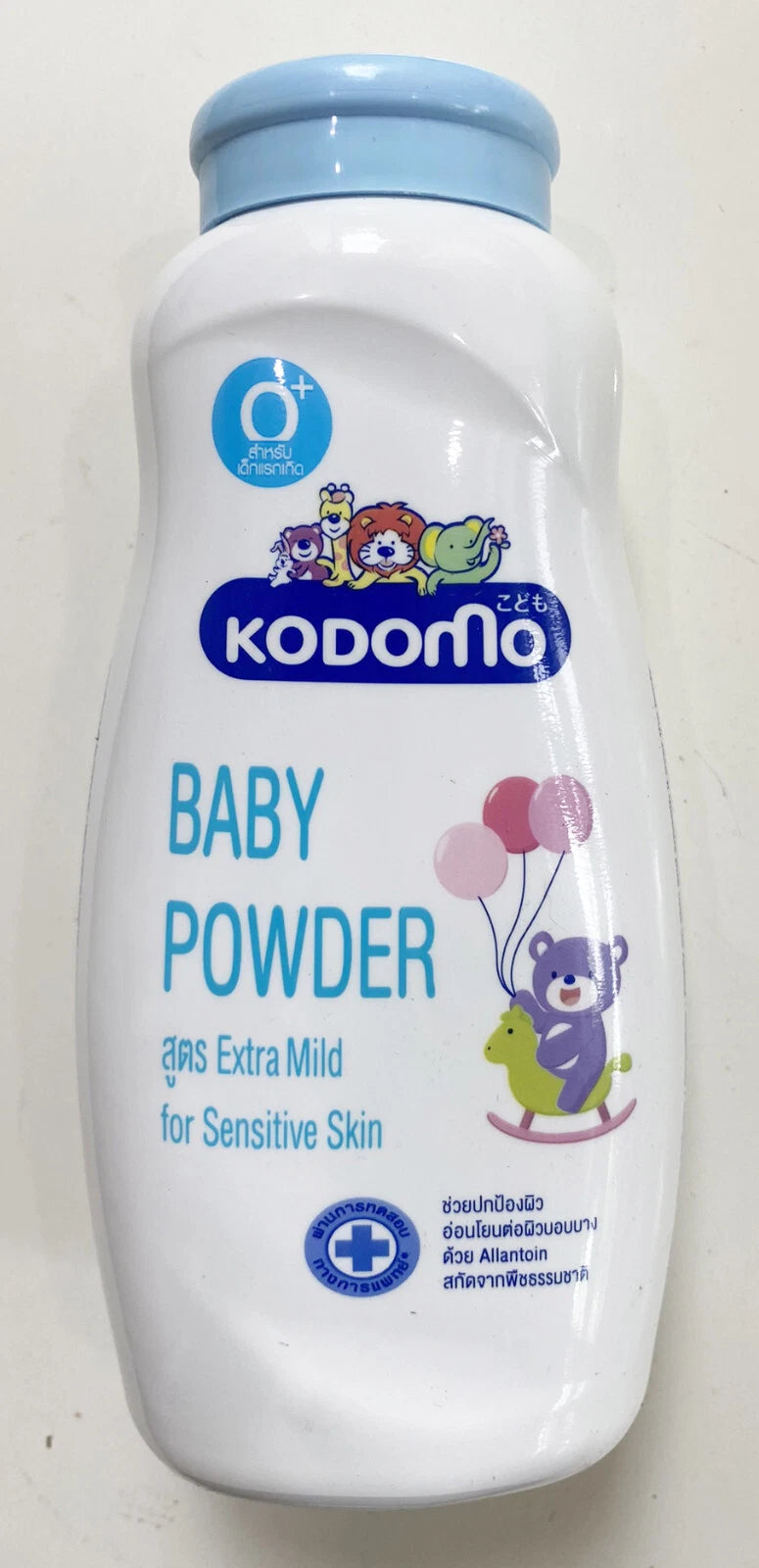 Kodomo Baby Powder Extra Mild bottle with safety and dermatologically tested certification marks