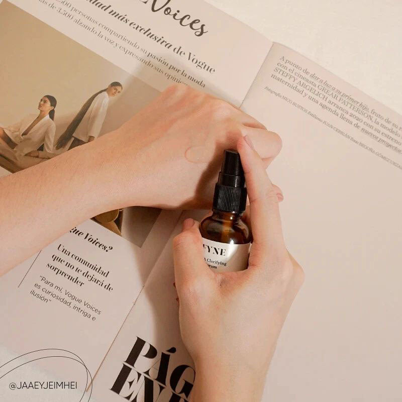 Applying FYNE BHA Clarifying Serum with a dropper onto the back of the hand