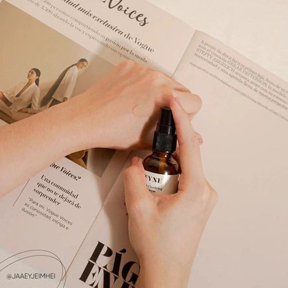 Applying FYNE BHA Clarifying Serum with a dropper onto the back of the hand