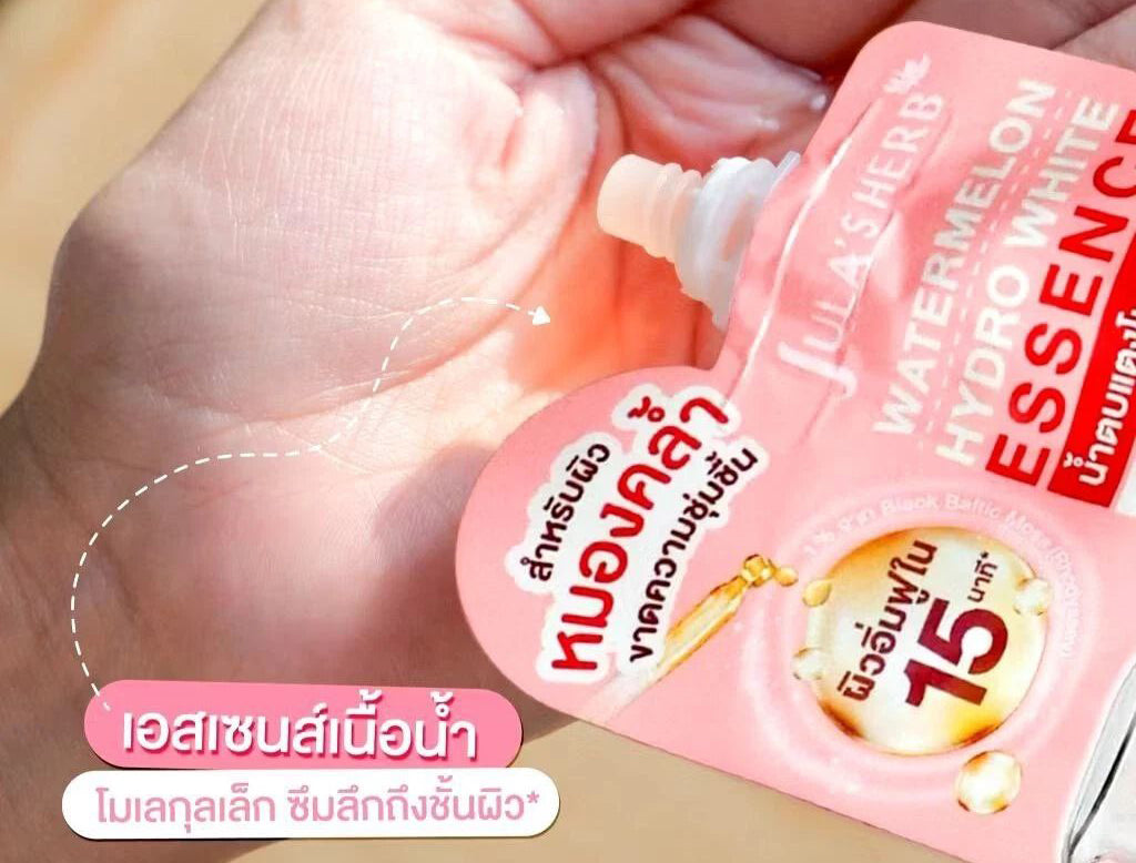 Jula's Herb Watermelon Essence hydration serum shown being applied to skin for radiant, plump appearance.