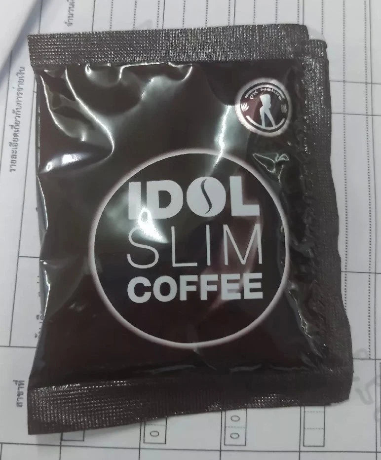 Single sachet of IDOL SLIM Coffee in black packaging on white background