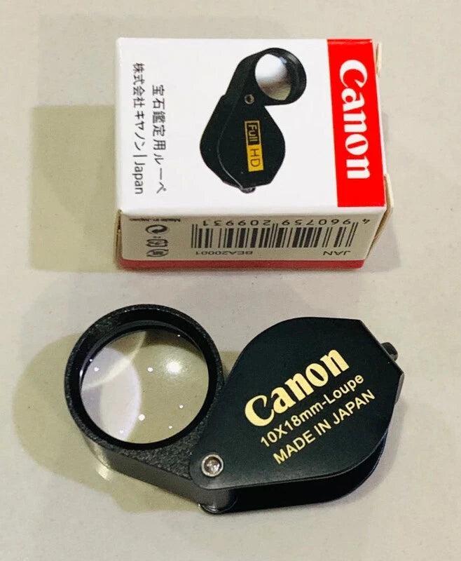Canon 10x Magnifier full HD 10x18mm jewelry amulet loupe lens in black with packaging.