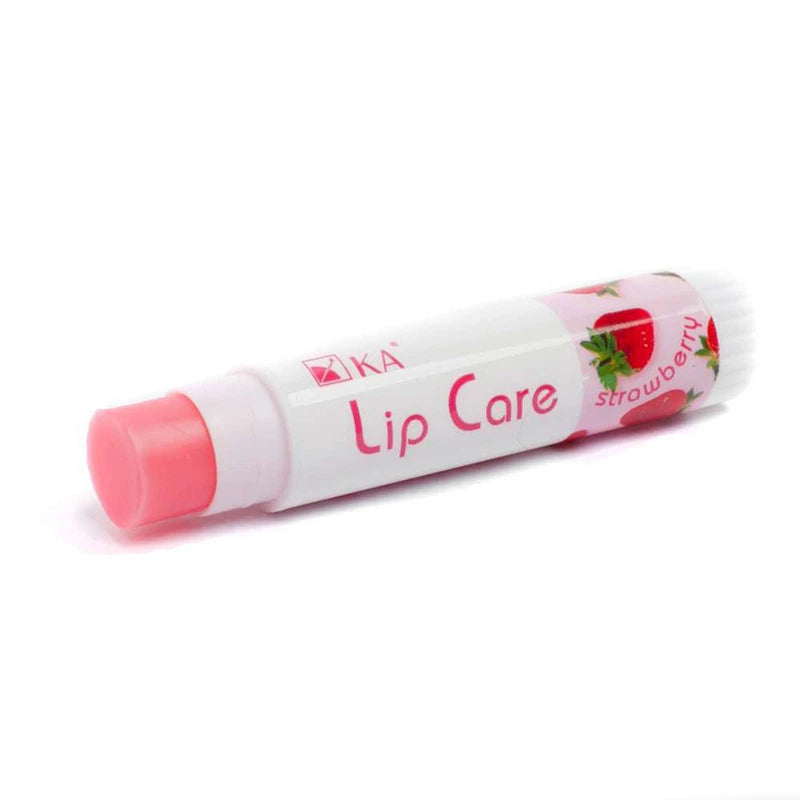 KA Lip Care Plus Strawberry lip balm tube lying diagonally with strawberry print design