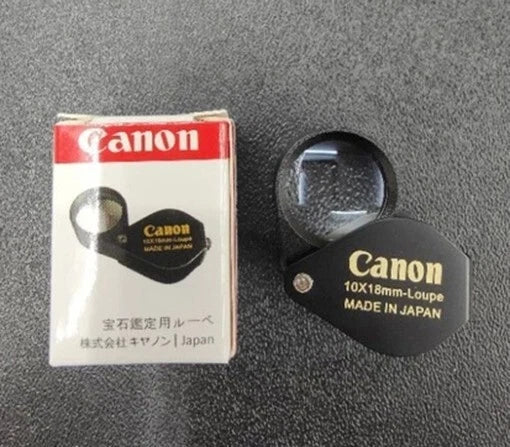 Canon 10x Magnifier loupe packaging box and black lens front view