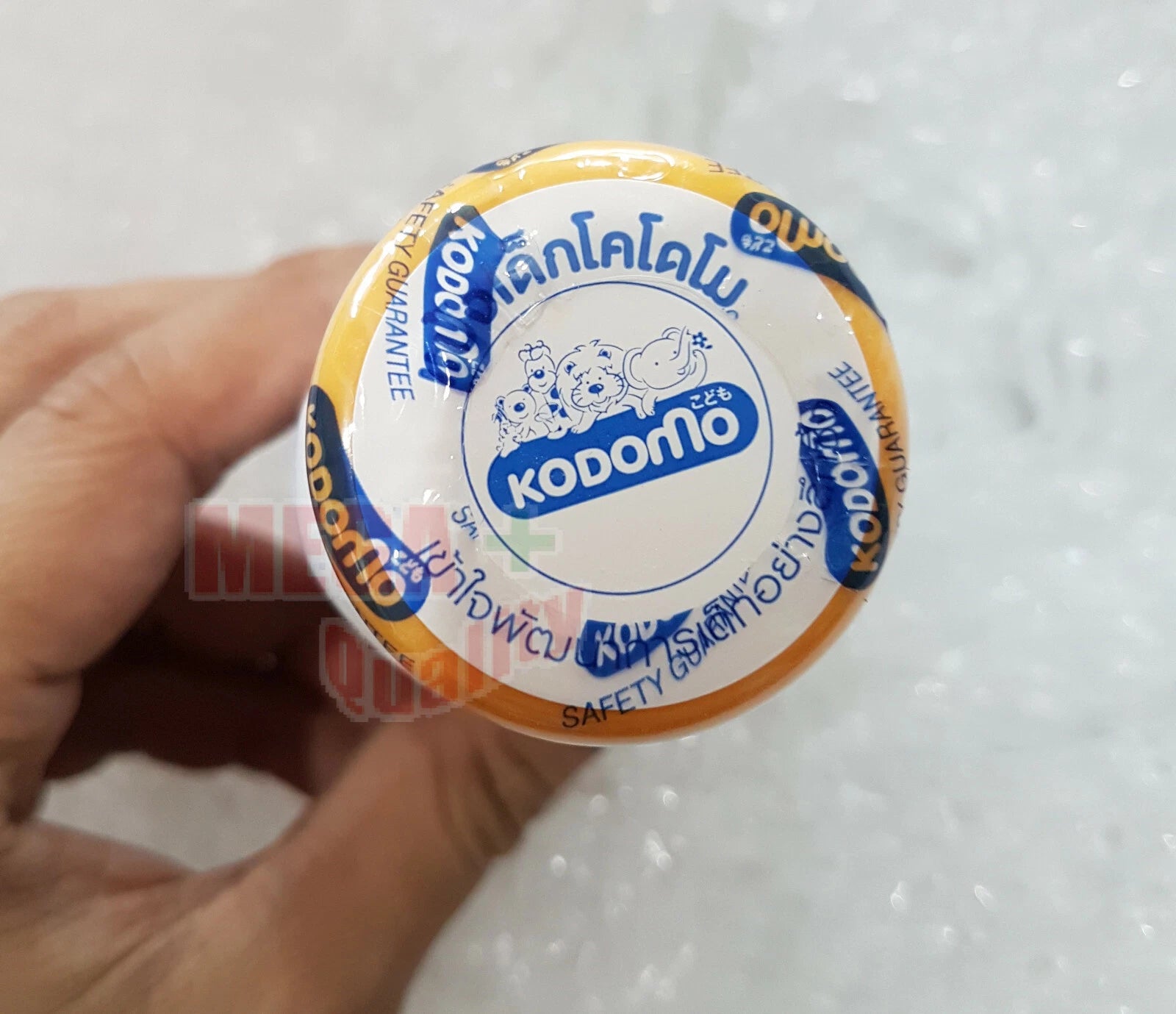 Top view showing the cap of the Kodomo Baby Powder 3+ bottle.