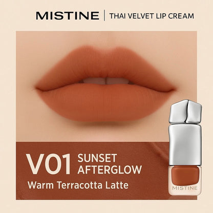 Mistine Velvet Lip Cream V01 Sunset Afterglow lip swatch on a model showing the warm terracotta latte shade.