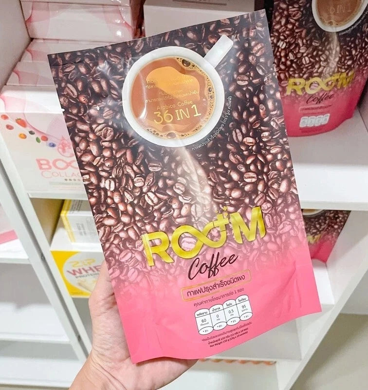Room Coffee 36 in 1 Instant Coffee package hand held on shelf