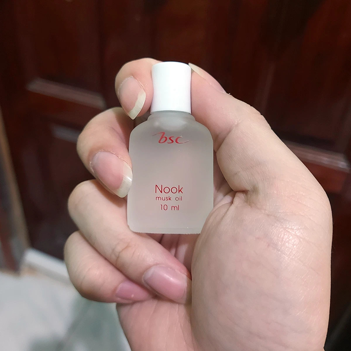 BSC Nook Musk Oil 10ml held in hand showing bottle size