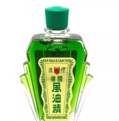 Eagle Brand Medicated Oil in green glass bottle, 12ml, used for pain relief and herbal therapy.