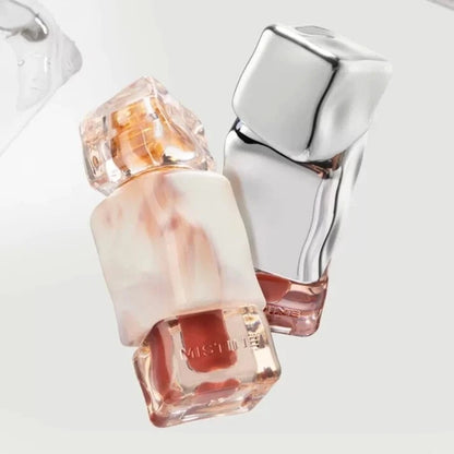 Close-up of the Mistine Velvet Lip Cream elegant container showing the creamy liquid texture inside.