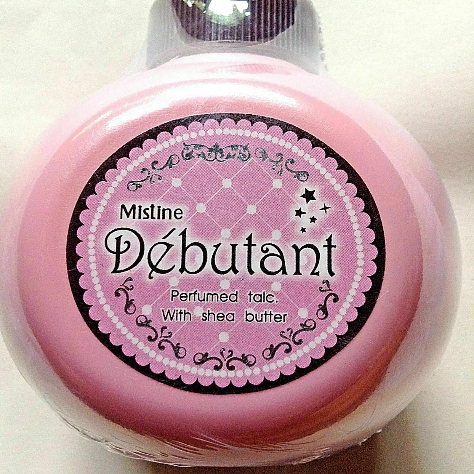 Mistine Debutant Perfumed Talc with Shea Butter in pink packaging for silky smooth skin