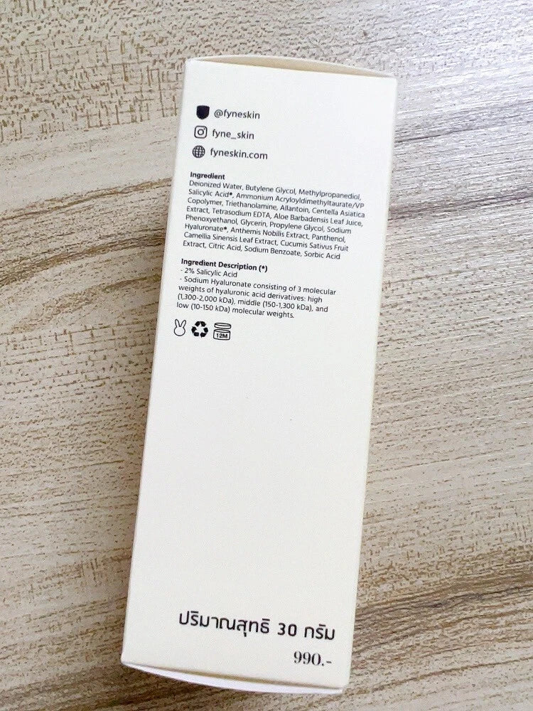 FYNE BHA Clarifying Serum product box photographed on a wooden surface displaying printed details