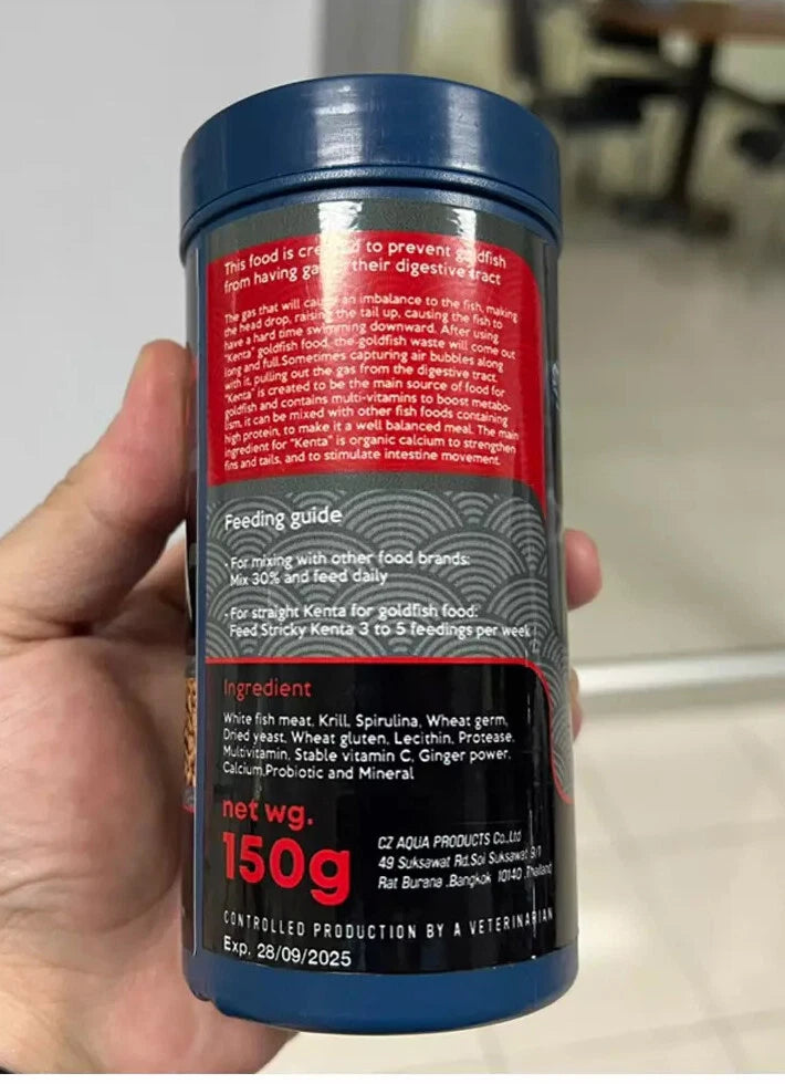 Hand holding Kenta Goldfish Food Gas Release Formula 150g container back label