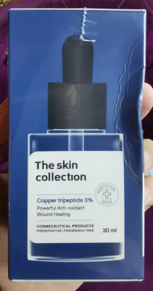 The Skin Collection Serum dropper bottle close up blue glass packaging