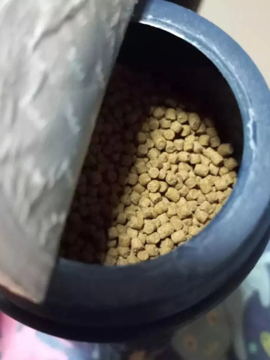 Open container of Kenta Goldfish Food showing sinking pellet fish food