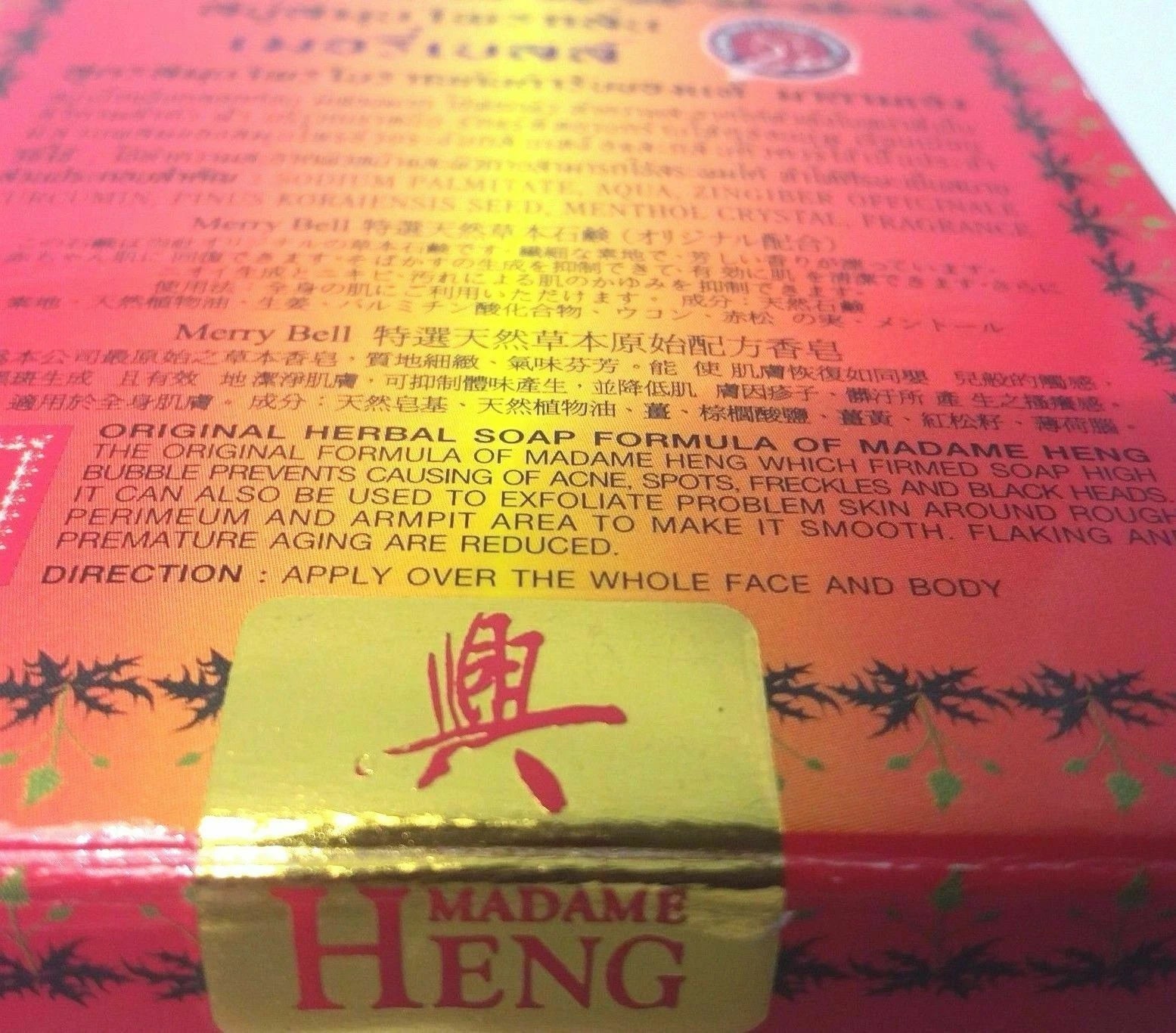 Madame Heng Merry Bell Herbal Soap packaging highlighting acne treatment and dark spot reduction benefits.