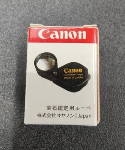 Canon 10x Magnifier packaging front view with loupe inside box