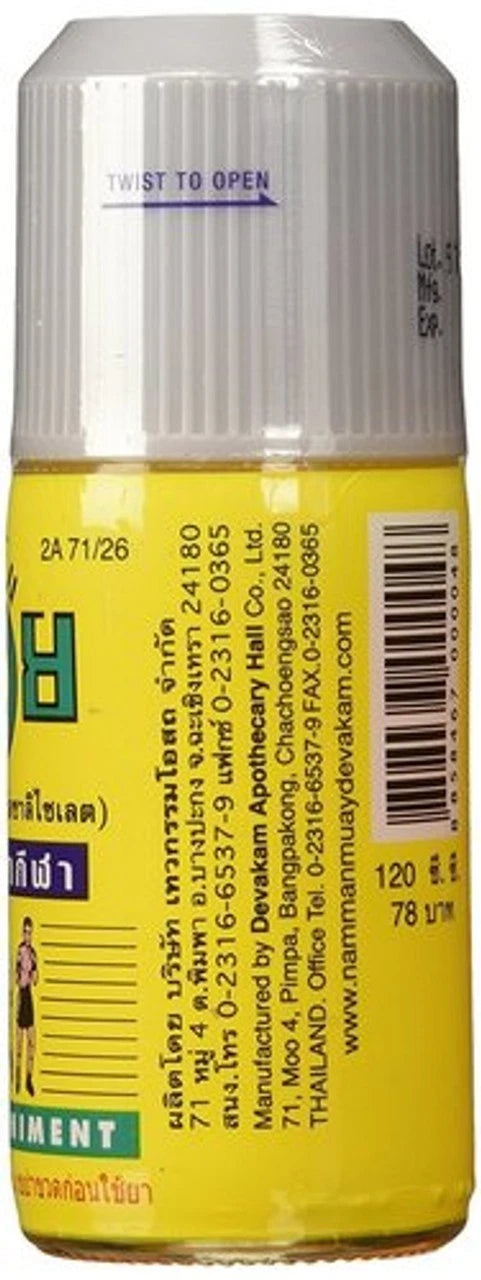Namman Muay Liniment Oil close-up rear label displaying directions and ingredients for muscle warm-up and joint comfort