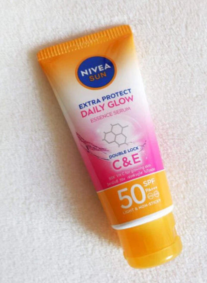 Nivea Sun Daily Glow Essence Serum tube angled view on surface 70ml