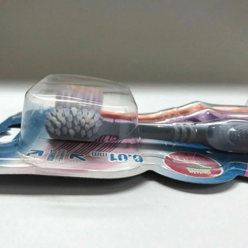 Side view of Oral B Compact Gum Care toothbrush pack sealed in plastic