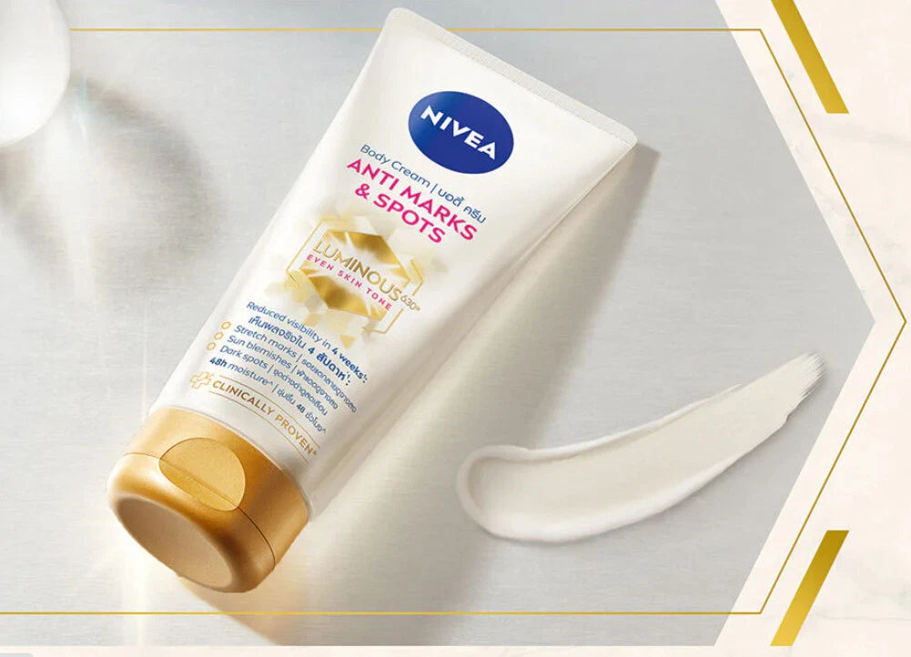 Nivea Luminous 630 Body Cream texture and packaging design gold cap white tube