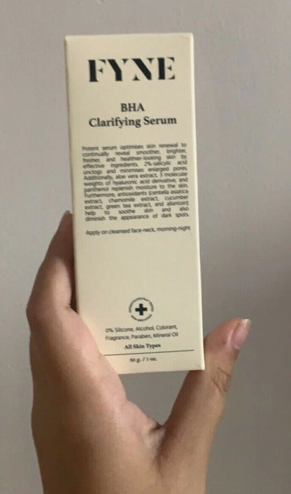 Front view of the FYNE BHA Clarifying Serum product box held in hand displaying label details