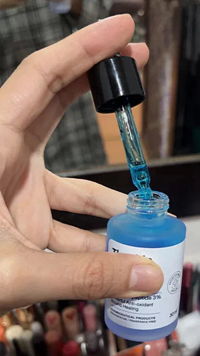 The Skin Collection Serum dropper usage applying serum on hand