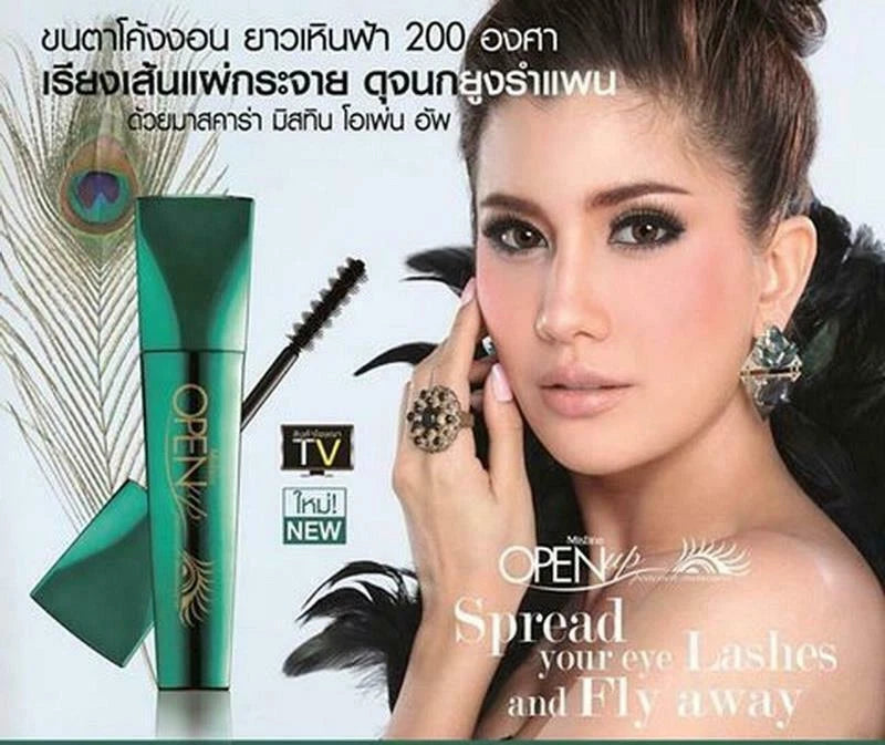 Mistine Open Up Peacock Mascara product with model demonstrating bold eye makeup