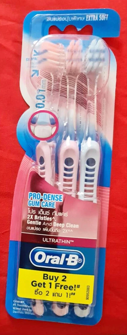 Oral B Gum Care Toothbrush set with red background and yellow Buy 2 Get 1 Free label.