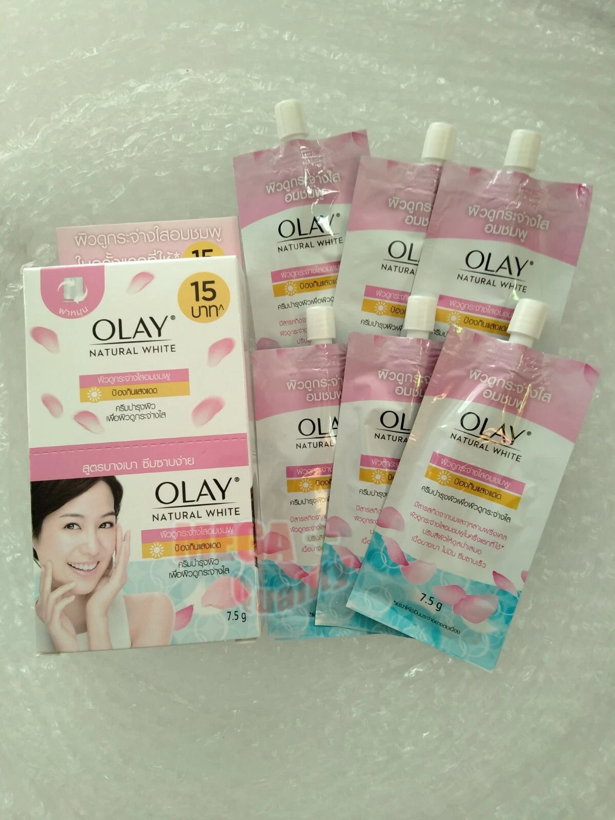 Olay Natural White Pinkish Fairness UV cream sachets 7.5g in a 6-pack for skin brightening and UV protection.