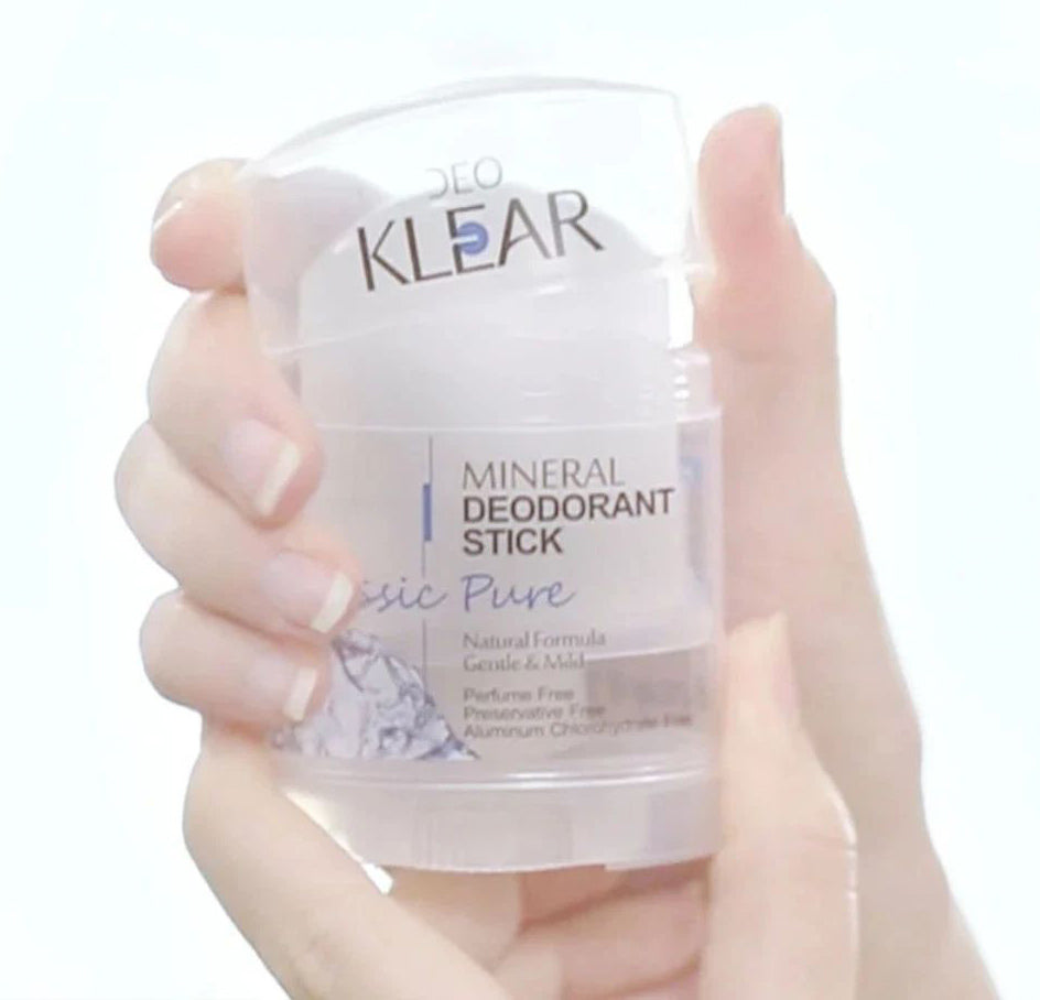 Deo Klear Mineral Deodorant stick held in hand showing size and packaging