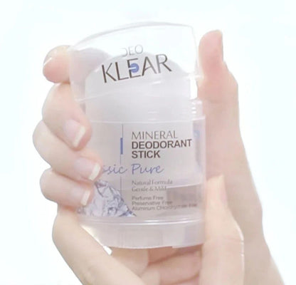 Deo Klear Mineral Deodorant stick held in hand showing size and packaging