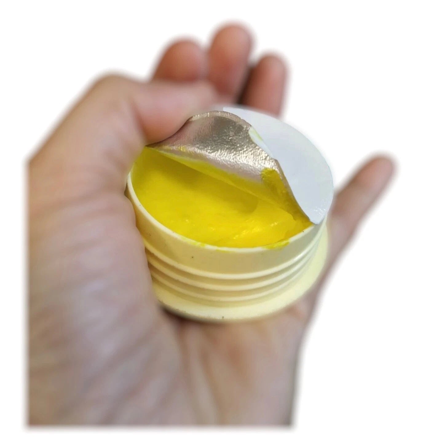 Bio Way Banana Heel Cream cream texture in hand showing yellow formula