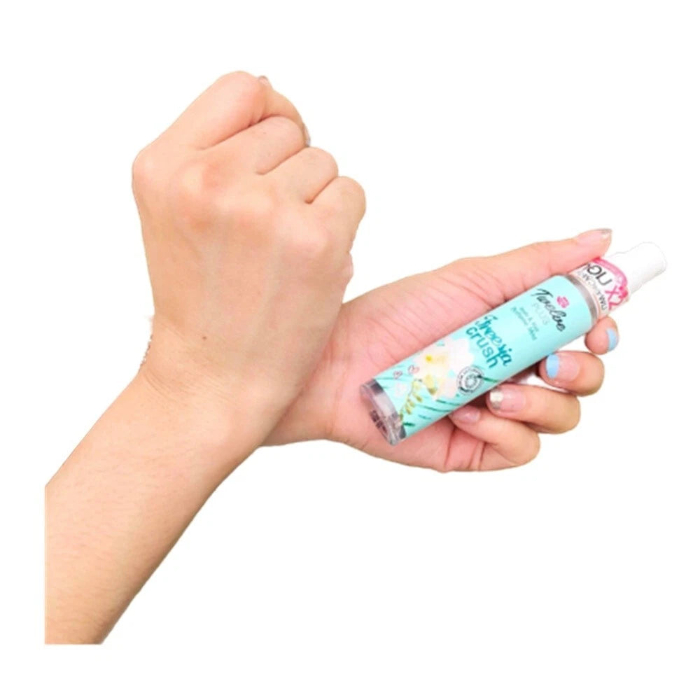 Twelve Plus Freesia Crush Mist body hair perfume spray in hand usage