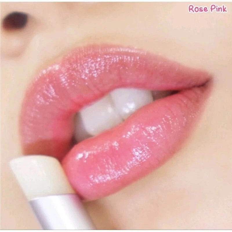 Close-up of lips wearing the lip balm showing soft pink tint