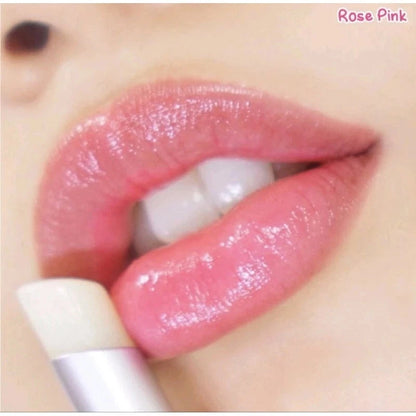Close-up of lips wearing the lip balm showing soft pink tint